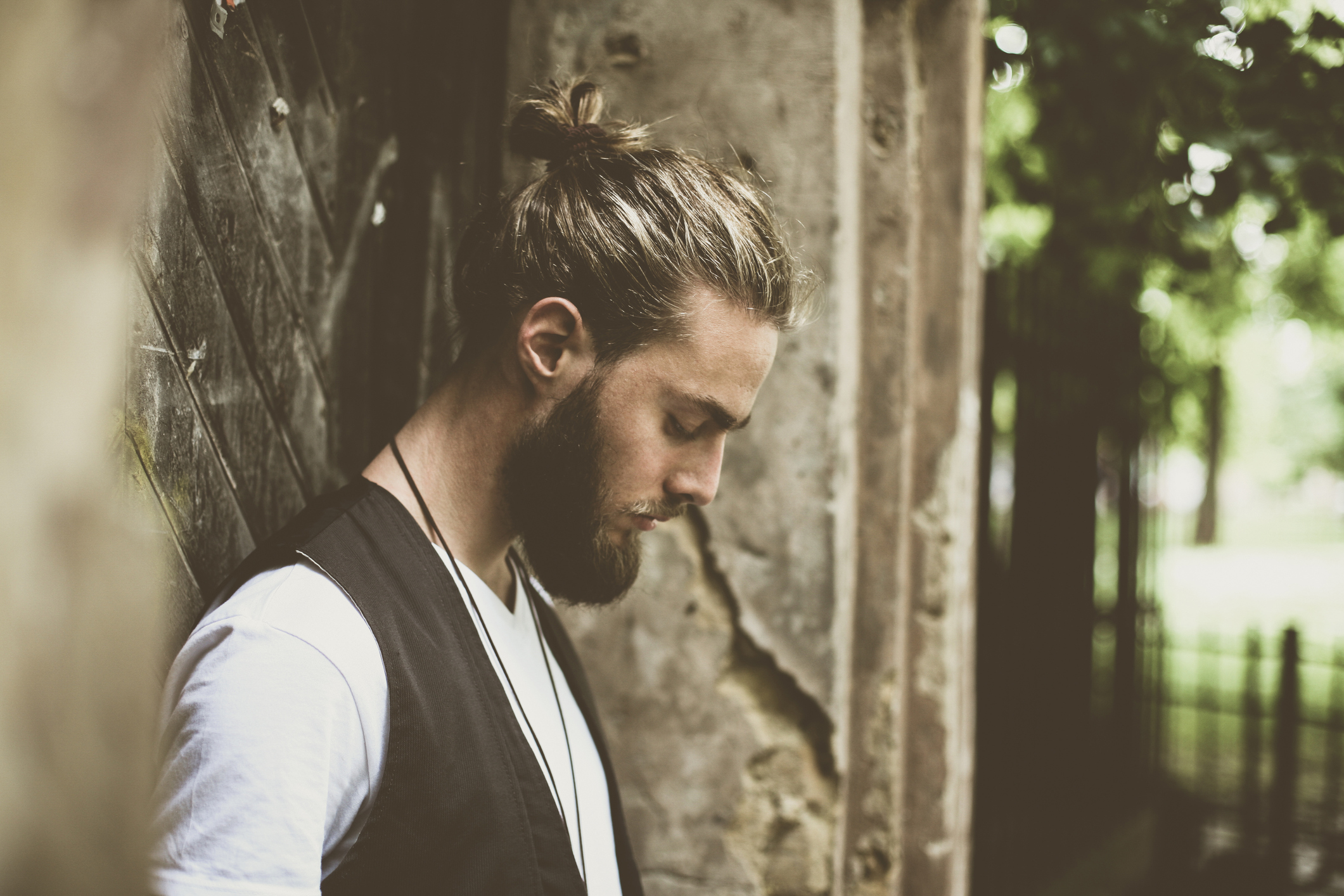 Close-up shot of young handsome hippie man. Space for copy.