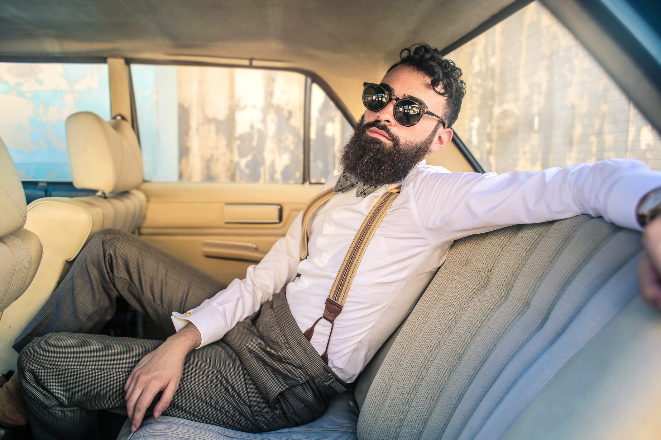 Man sitting in a vintage car