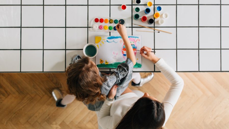 young child drawing a thank you picture