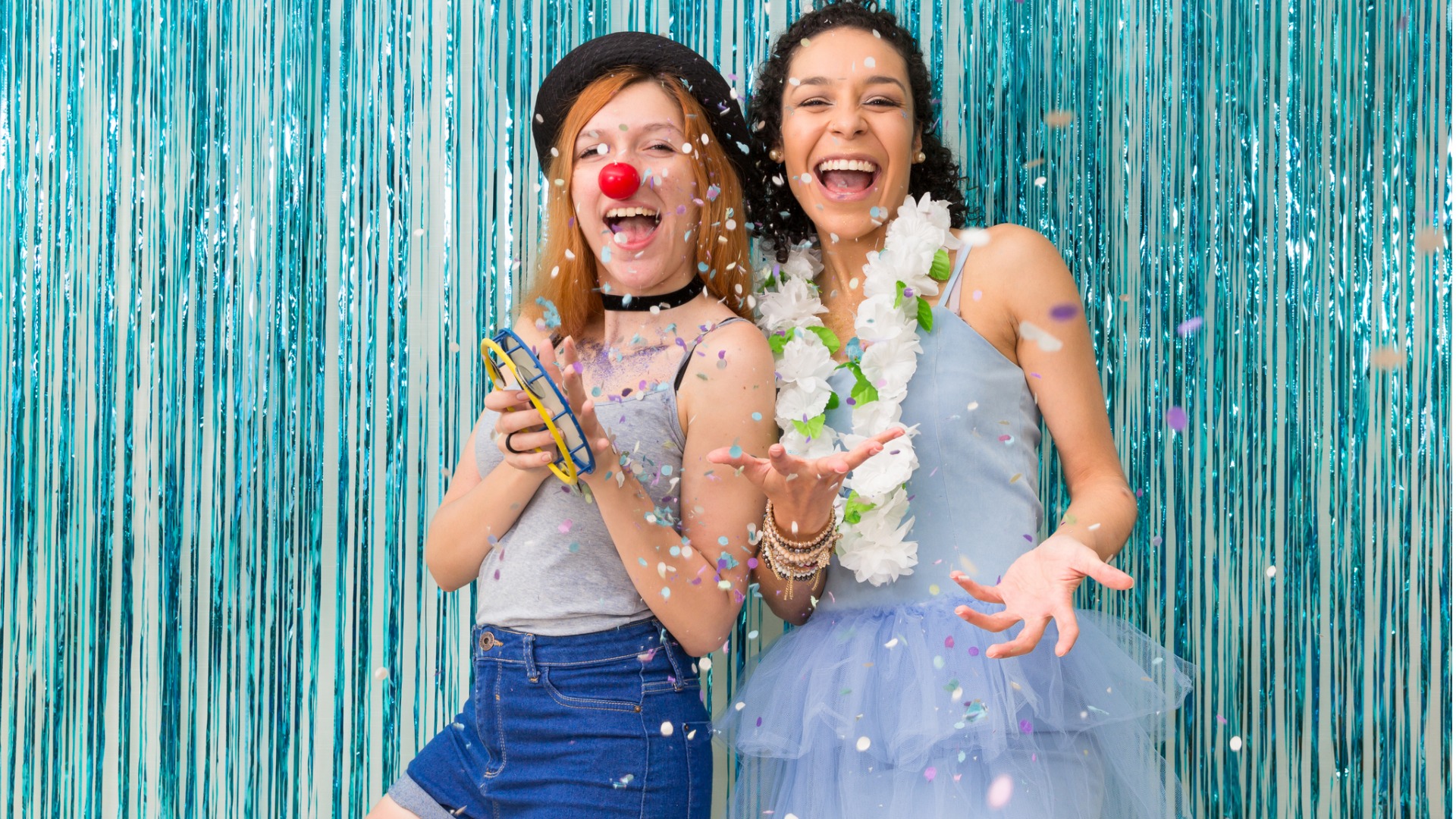 two-friends-are-celebrating-carnaval-blue-color-predominant-confettin-picture-id901980716