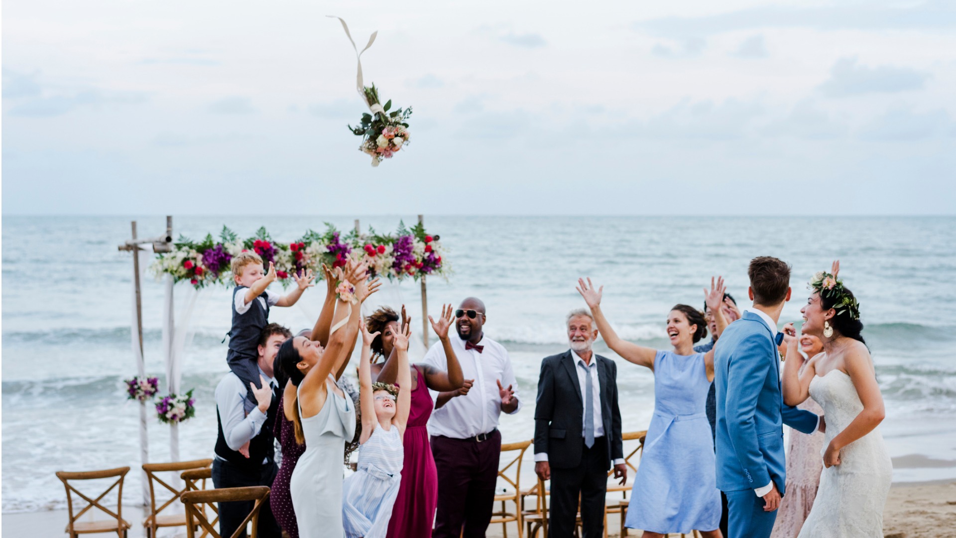 bride-throwing-the-bouquet-at-wedding-picture-id1040949944