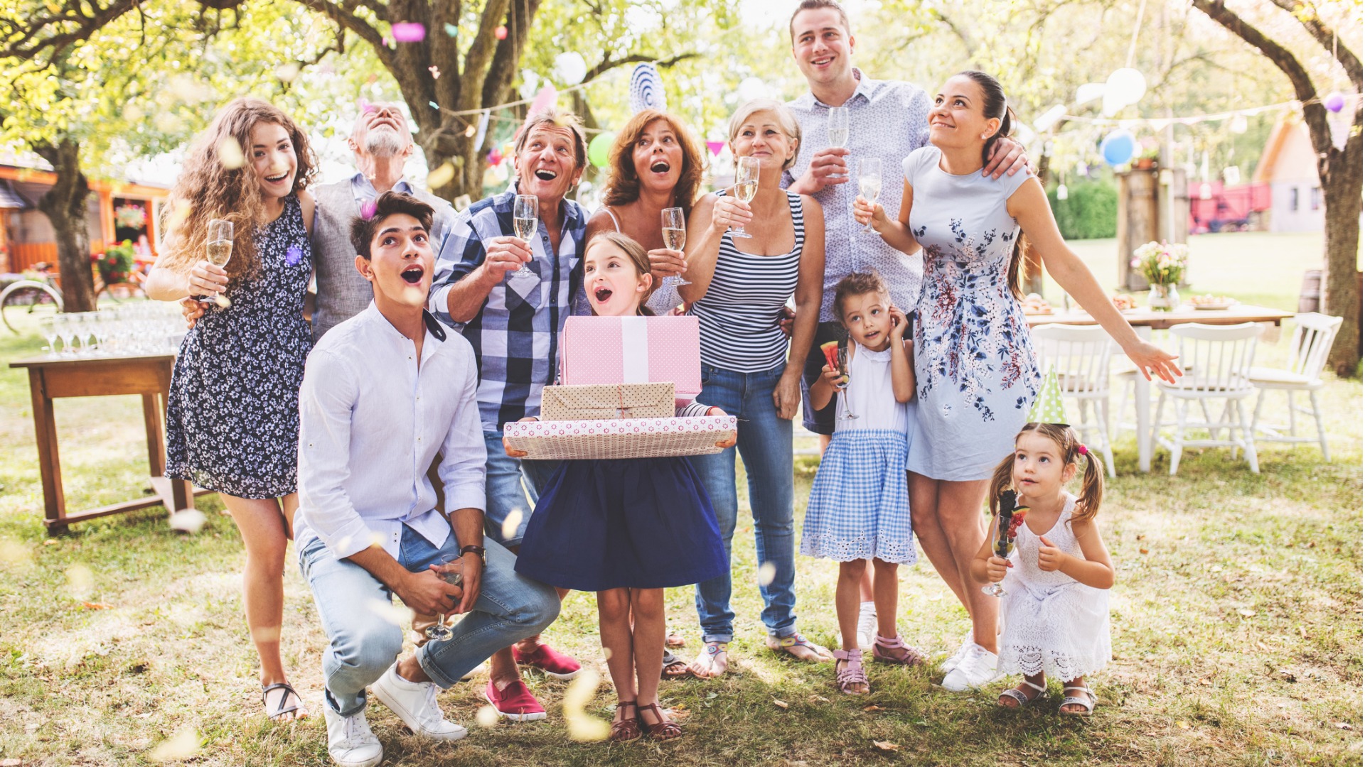 family-celebration-or-a-garden-party-outside-in-the-backyard-picture-id937823240